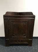 An early 20th century mahogany corner cupboard