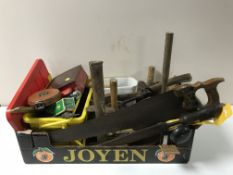 A metal tool box and leather case of vintage hand tools and hard ware