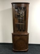 A mahogany corner display cabinet