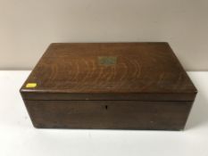 An early 20th century oak canteen of cutlery, 'Presented to Mr. H.