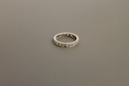 A platinum and diamond eternity ring
