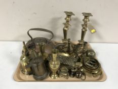 An antique copper kettle and brass ware