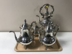 A four-piece 20th century plated tea service and matching spirit kettle