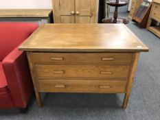 An oak three drawer plan chest