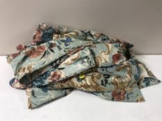 A quantity of floral patterned curtains with tie backs and bed linen