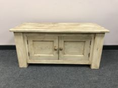 A painted pine double door storage chest