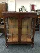 A double door mahogany display cabinet