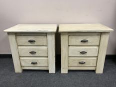 A pair of painted pine three drawer chests (2)