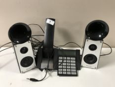 A Bang and Olufsen BeoCom 2500 telephone set together with a pair of Ravon multimedia speakers