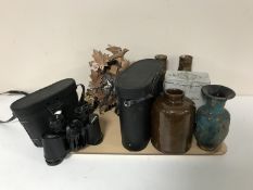 A tray of tins, pottery vases, binoculars,