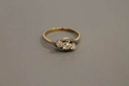 An 18ct gold three stone diamond ring,