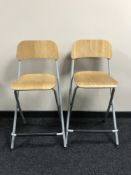 A set of four folding kitchen breakfast bar stools