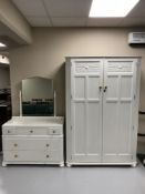 A painted oak double door wardrobe and dressing chest