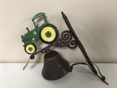 A cast iron green tractor bell