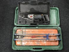 A cased Casals professional hammer drill together with a cased Rubi tile cutter