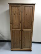 A pine double door wardrobe