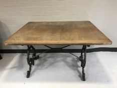 An oak topped and cast iron pub table