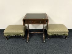 A mahogany leather topped sofa table and a pair of upholstered footstools