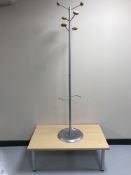 A contemporary office coffee table and a hat & coat stand