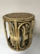 A set of three graduated wicker stools