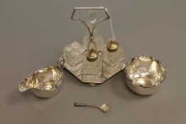 A silver plated cruet stand, silver caddy spoon,