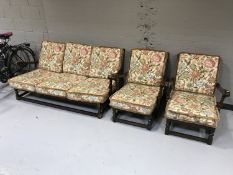 A three piece Ercol lounge suite upholstered with floral fabric