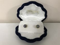 A pair of 18ct black pearl earrings in case and a sterling silver handled file