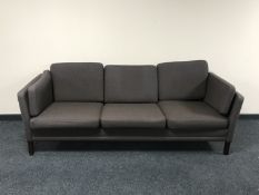 A late 20th century Danish three seater settee in brown fabric