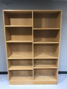 A set of oak effect open shelves
