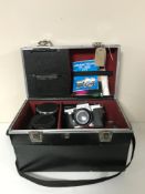 A camera case containing Praktika TL5B camera with lens and accessories