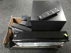 A Sony 3d blue-ray surround sound system with remote together with a Sony S-air box