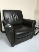 A brown leather Barker & Stonehouse club armchair