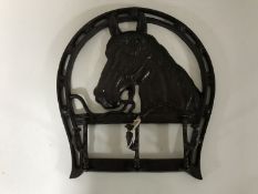 A cast iron horse head hook
