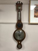 An early Victorian inlaid mahogany barometer