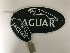 Two cast iron plaques - Jaguar