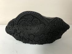 A wooden printing stamp