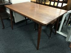 A late 20th century teak extending table