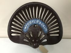 A cast iron Doyle tractor seat