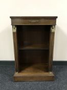 A Chapmans Siesta mahogany open dwarf bookshelf with gilt mounts