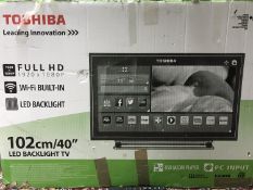A boxed Toshiba 40 inch LED backlit tv with lead and remote