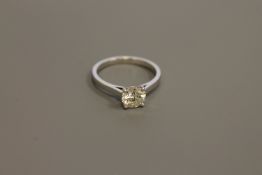An 18ct white gold diamond solitaire ring, the brilliant cut stone weighing an estimated 1.