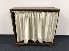 A mahogany shoe cabinet