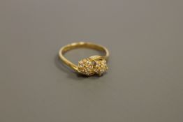 An 18ct gold double cluster ring