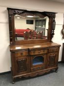 A late Victorian mirror backed walnut sideboard