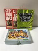 Two boxes of a quantity of Guinness Book of Records, coffee table volumes,