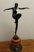 An Art Deco style bronze figure of a dancer, on circular marble base,