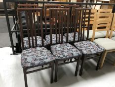 A set of six high backed dining chairs