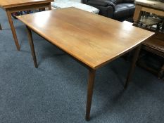 A late 20th century Danish teak extending dining table