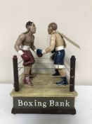 A cast iron boxing money bank