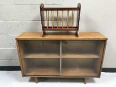 A teak sliding door bookcase and a mag rack